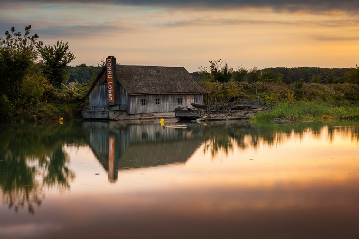 Wooden mill house on the Danube River in Austria