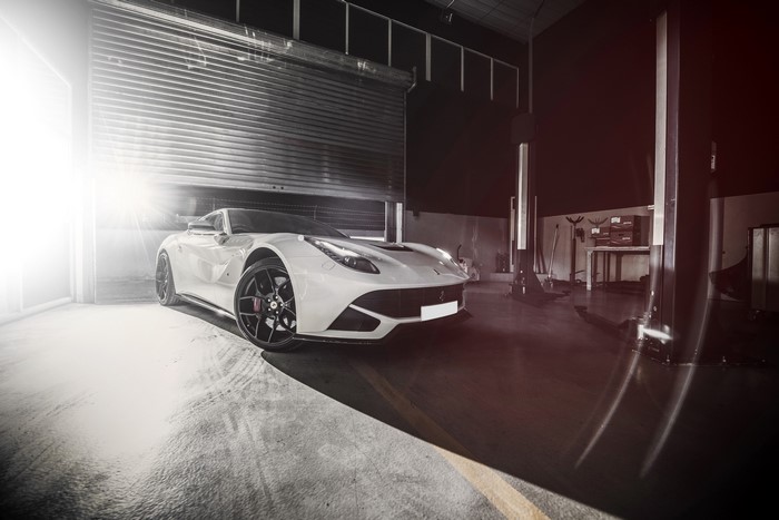 White 2014 Ferrari F12berlinetta in a garage