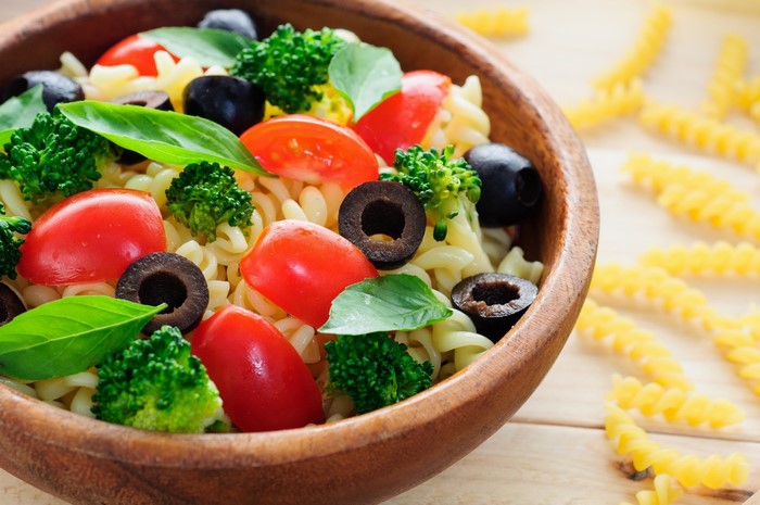 Pasta salad with tomatoes, broccoli, and olives