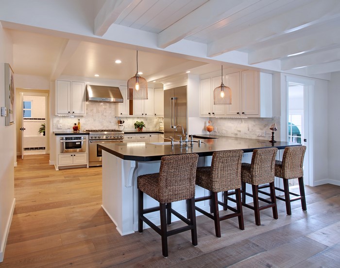 Kitchen with Island, Chairs, and Pendant Lamps