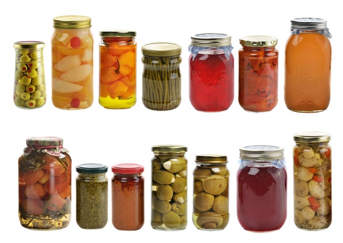 Many jars of preserved vegetables and fruits