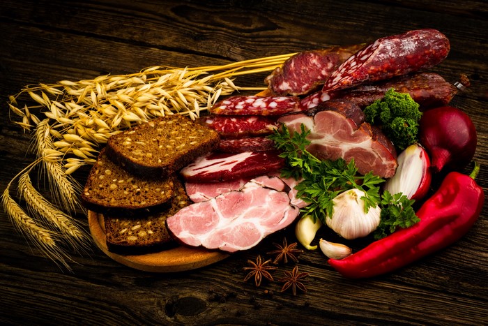 Meat products, sausage, ham, bread, bell pepper, garlic, and wheat