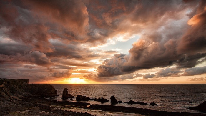 Sunset over the rocky coast and ocean