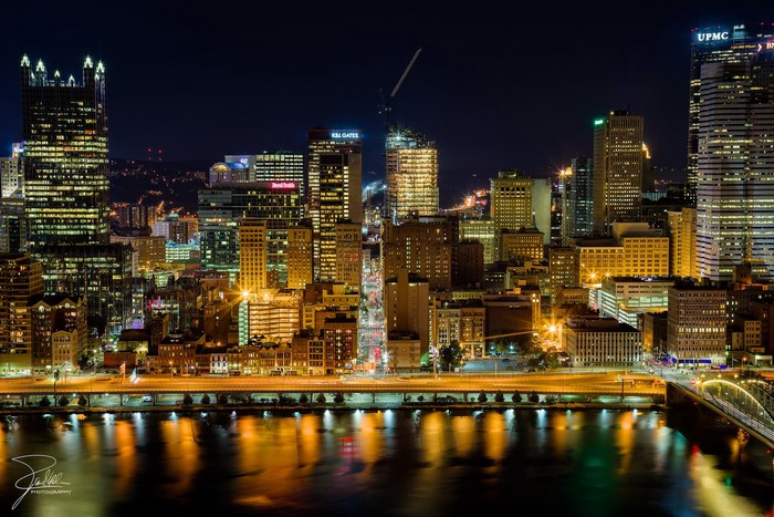 Pittsburgh skyline at night with reflections on the river