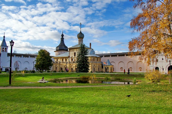 Monastery complex with pond and autumn trees in Russia