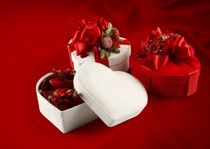 Heart-shaped gift boxes with red bows