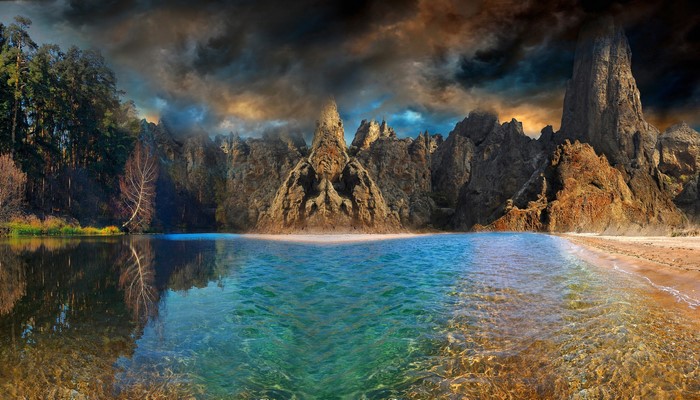 Fantasy landscape with mountains, lake, and forest