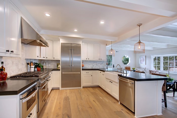 Modern White Kitchen with Stainless Steel Appliances