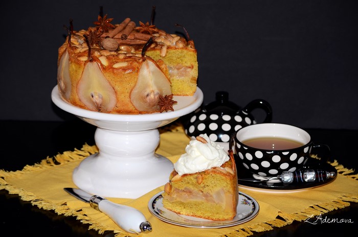 Pear cake with tea and whipped cream
