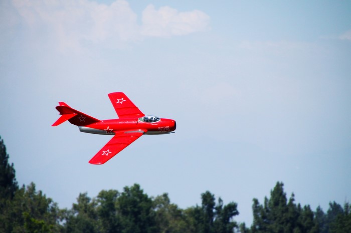 Red Mig-15 Fighter Airplane in Flight