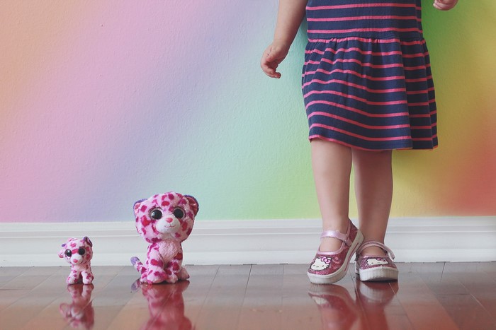 Girl with stuffed animals