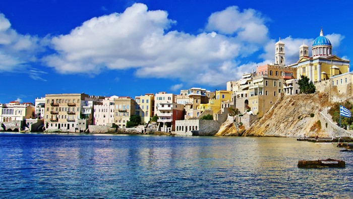 Colorful buildings on a hill overlooking the sea in Greece