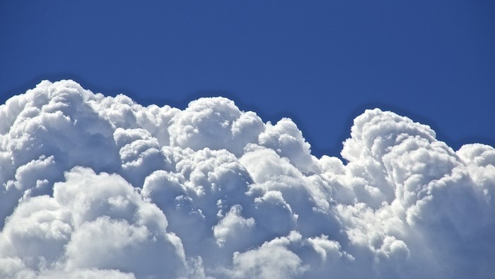 Cumulus clouds against a blue sky