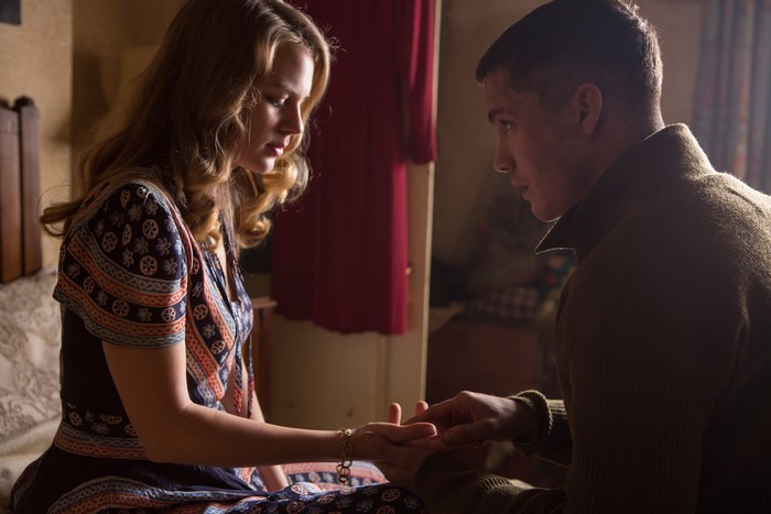 Couple holding hands in a room