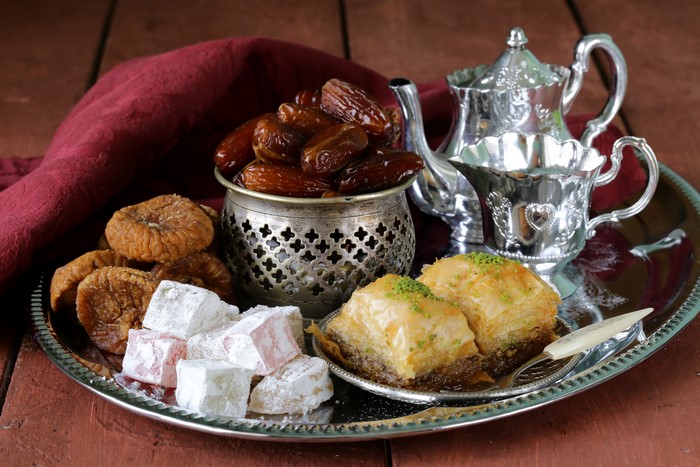 Sweets and tea set with dates and figs