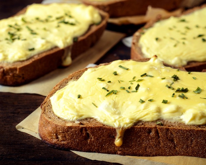 Butterbrot with melted cheese and herbs