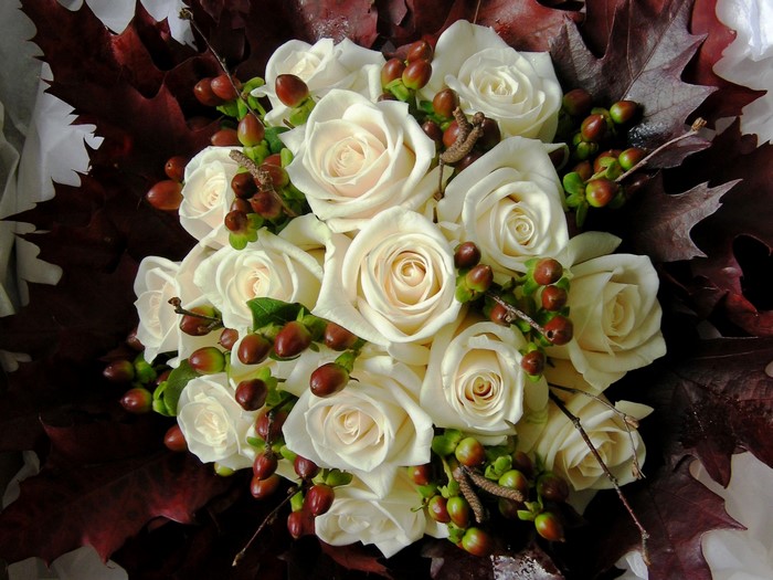 White roses and dark leaves bouquet
