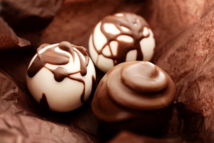 Chocolates with chocolate drizzle and swirl
