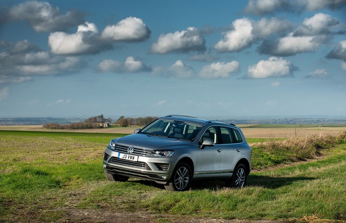 Silver Volkswagen Touareg SE in a field