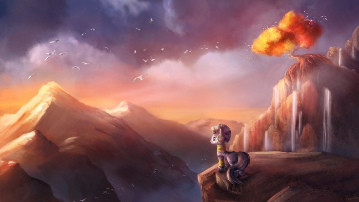 Pony on a cliff overlooking mountains at sunset