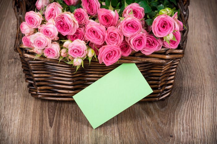 Pink Roses in a Wicker Basket with a Green Card