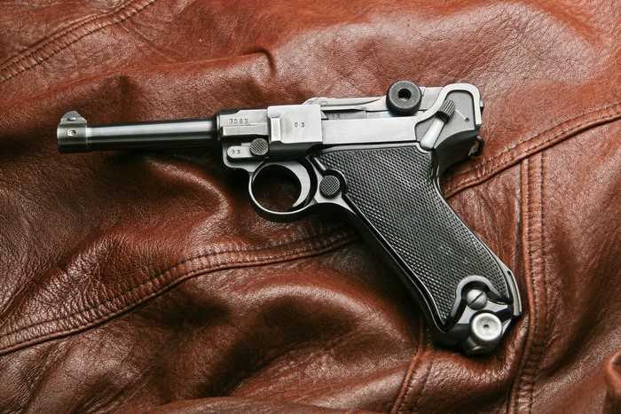 Luger P08 Parabellum pistol on brown leather