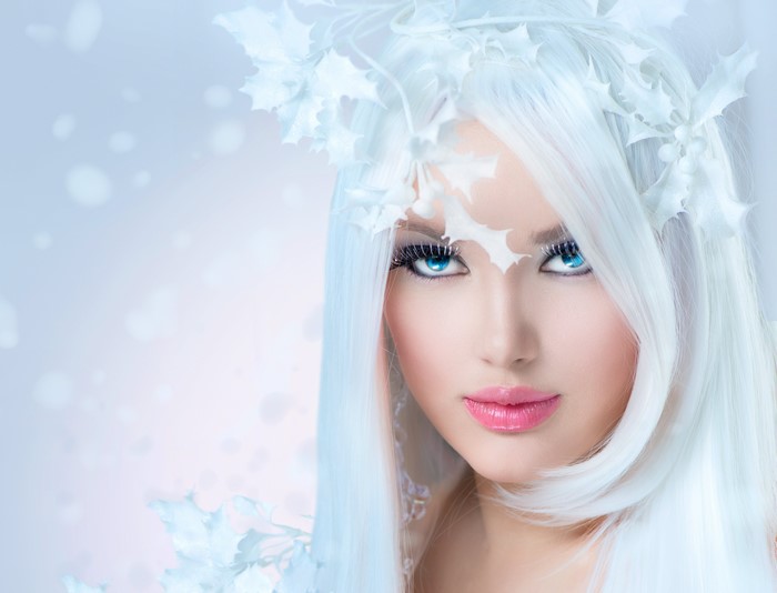 Woman with white hair and holly crown