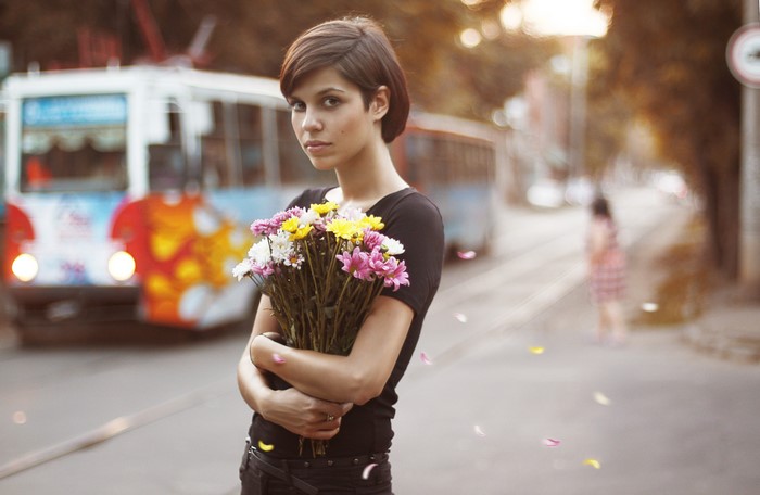 Woman holding a bouquet of flowers