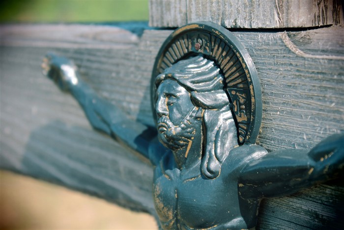 Close-up of Jesus on a wooden cross