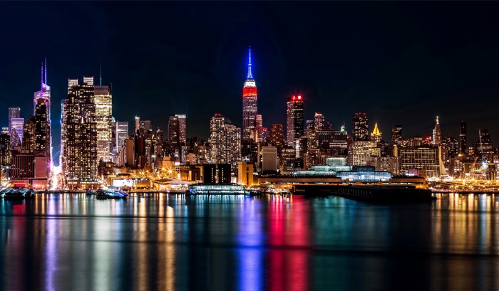 New York City Skyline at Night with River Reflections