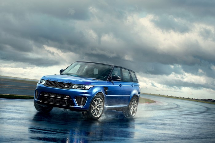 Blue Range Rover Sport SVR on a wet track