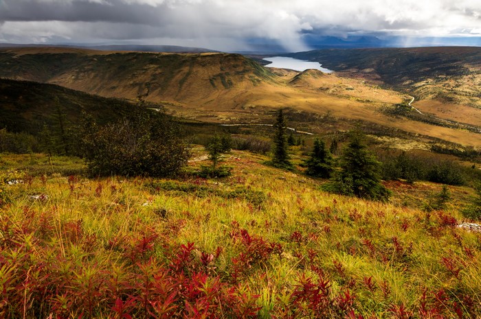 Mountainous Landscape with Lake and Stormy Sky in Alaska