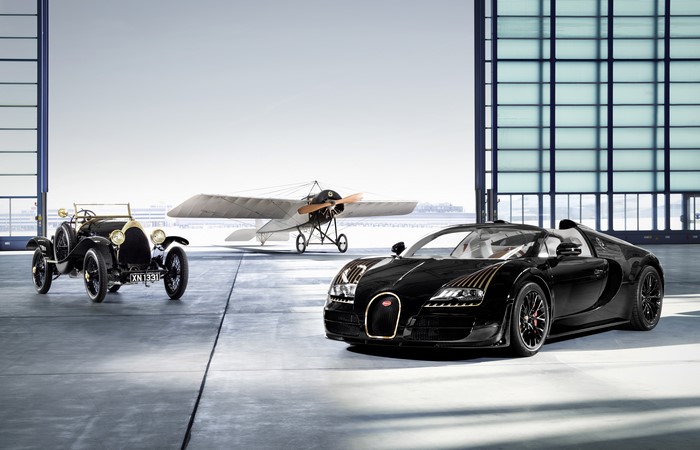 Bugatti Veyron 16.4 Black Bess and vintage car with biplane