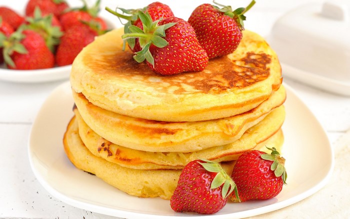 Stack of Pancakes with Strawberries on a Plate