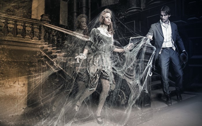 Man and ghost woman on stairs