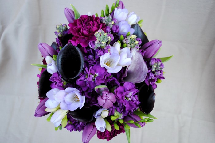 Purple and white floral bouquet with tulips and callas