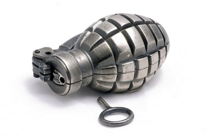 Hand grenade with pin on white background