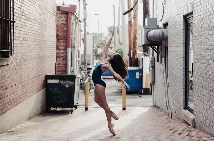 Ballerina dancing in an alleyway