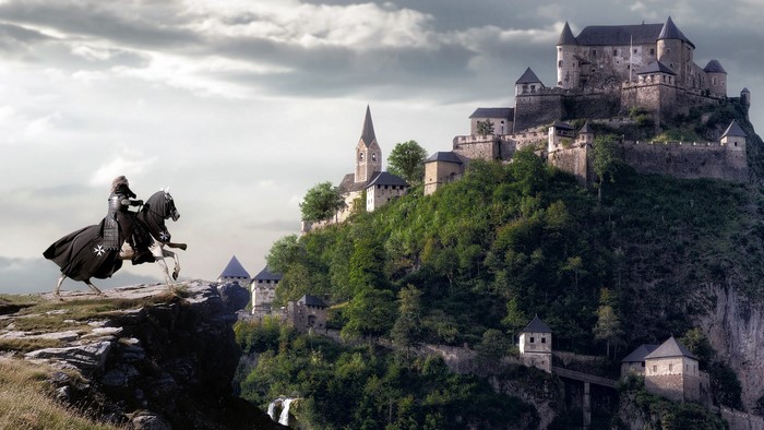Knight on horseback before a castle on a hill