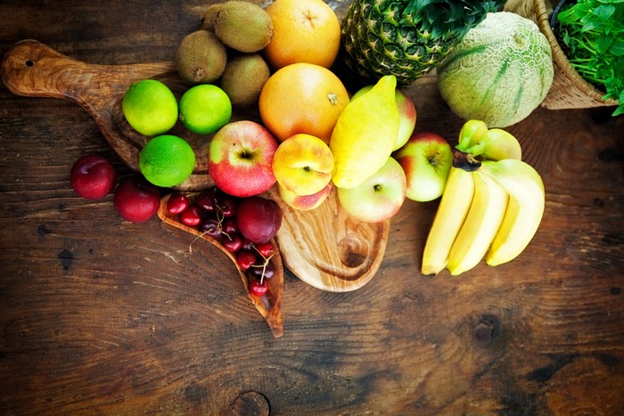 Assortment of Fresh Fruits on a Wooden Board