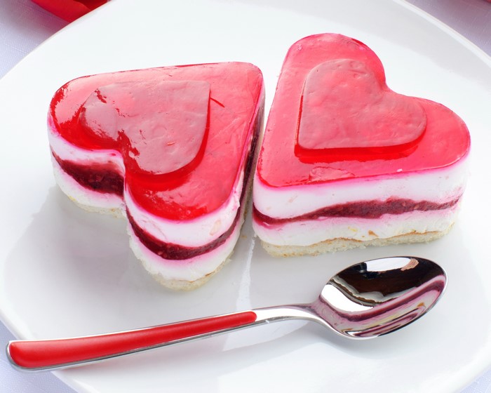 Two heart-shaped cakes with a spoon