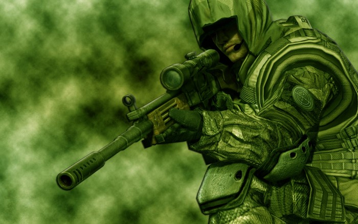 Soldier with sniper rifle in green camouflage