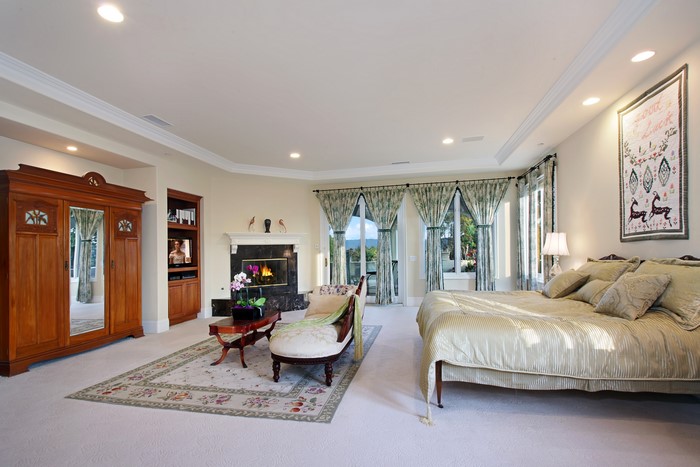 Bedroom with fireplace and large wardrobe