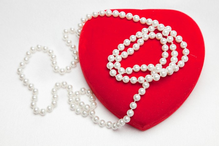 Pearl necklace on a red heart