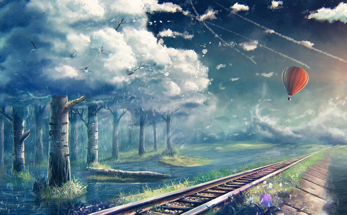 Hot air balloon over a forest and railroad tracks