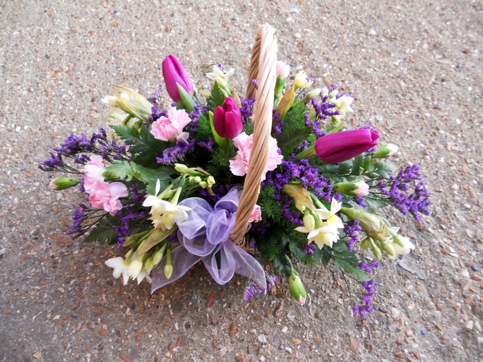 Flower basket with tulips, carnations, and daffodils