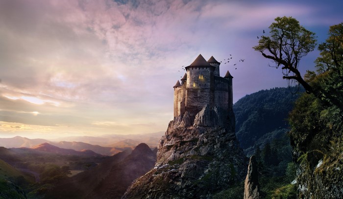 Castle on a rocky crag at sunset