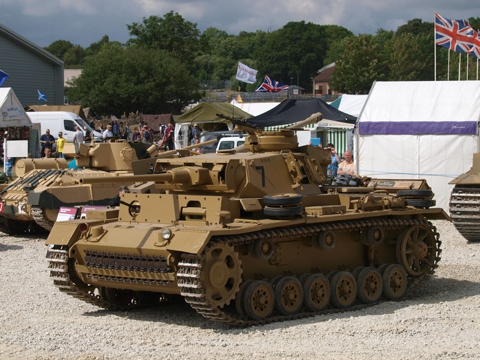 Panzer III tanks on display at an outdoor event