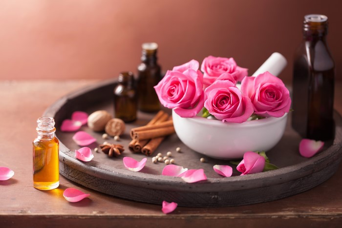 Pink Roses and Essential Oils on Tray