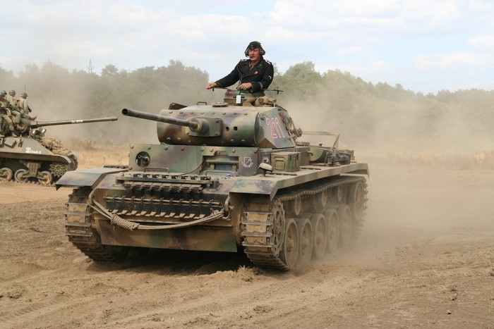 German PzKpfW III tank with crew in action